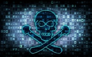 A conceptual image to show digital piracy. A black skull and cross bones with a light blue outline is set in the foreground in front of dozens of small screens