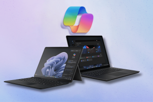 Microsoft focuses heavily on Copilot as new AI Surface products revealed. An image showcasing Microsoft's new AI Surface products, including a tablet and laptop, with the Copilot app on their screens, against a violet-hued backdrop with the Copilot logo floating above.