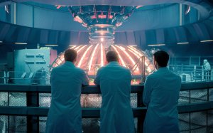 a fusion reactor with scientists looking at it from a guardrail, their backs turned to the viewer, cinematic