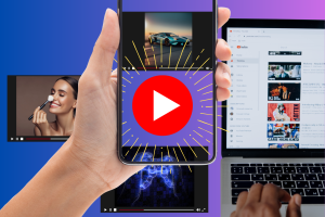 YouTube picture-in-picture may be rolled out to more free users. A hand holding a smartphone with multiple video streaming images overlapping. The largest image on the phone screen displays a prominent YouTube play button, indicating video content, surrounded by animated rays suggesting a highlight or selection. The smaller images within the phone screen showcase a sports car, a beauty tutorial, and a music visualizer. In the background, there's a laptop displaying a YouTube page with various video thumbnails and interface elements.